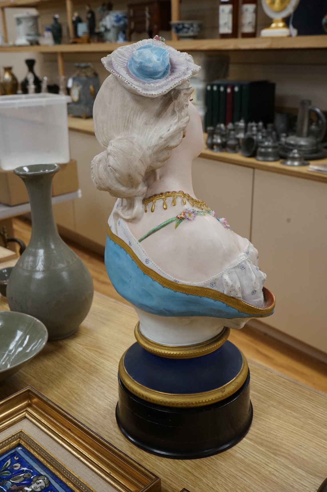 A Paris painted biscuit porcelain bust of a woman, stamped L&M, 50cm
